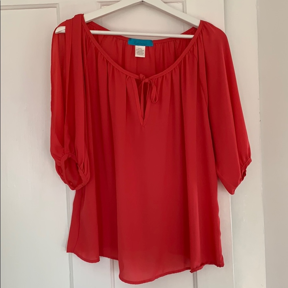 Pink blouse with shoulder openings